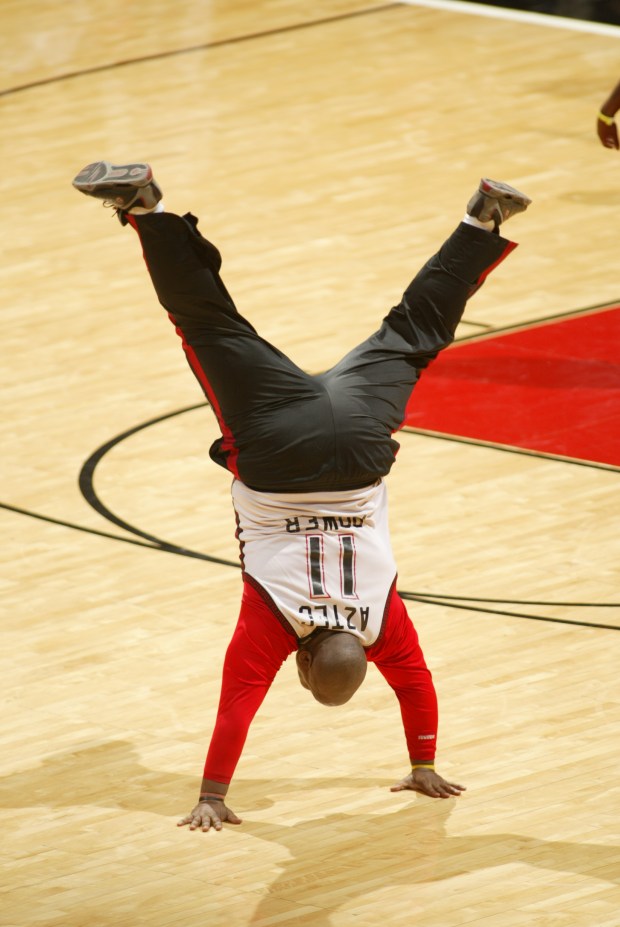 Longtime San Diego State superfan Chet Carney cartwheels during a San Diego State men's basketball game. (Stan Liu, SDSU athletics)