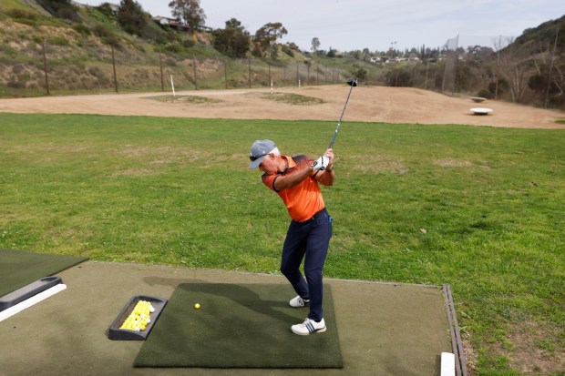 Mitch Harmatz hits at the Tecolote Canyon Golf Course driving range on Feb. 10, 2026, in San Diego. The range will stay open until Sunday while the rest of the course is now closed. (K.C. Alfred / The San Diego Union-Tribune)
