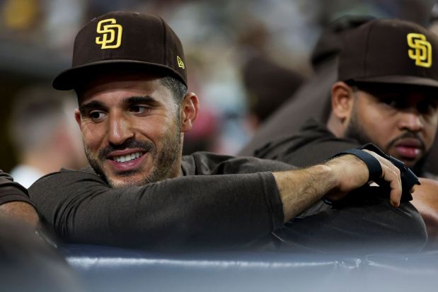 Ramon Laureano #5 of the San Diego Padres, wearing a splint on his finger, smiles in the dugout during their game against the Arizona Diamondbacks at Petco Park on Saturday, Sept. 27, 2025 in San Diego, California. (Meg McLaughlin / The San Diego Union-Tribune)