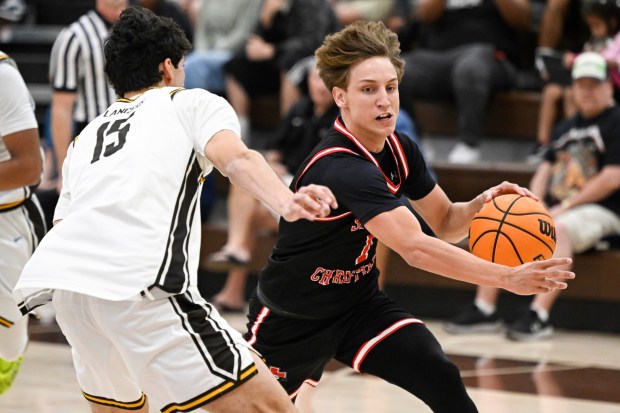 Santa Fe Christian's Dax Hall (1) drives past Francis Parker's Deven Dubois (15) during the second half Feb. 4, 2026 in San Diego, Calif. (Photo by Denis Poroy)