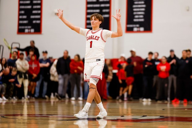 Santa Fe Christian's Dax Hall (1) celebrates after a three-pointer against Cathedral Catholic during the CIF San Diego Section Open Division boys basketball quarterfinal game at Santa Fe Christian School on Friday, Feb. 20, 2026 in Solana Beach, California. (Meg McLaughlin / The San Diego Union-Tribune)