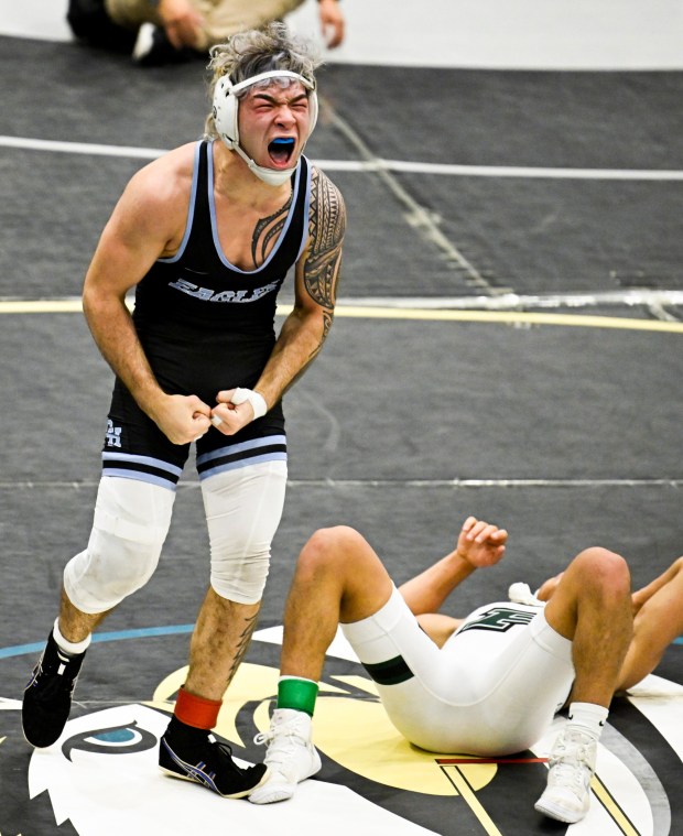 Granite Hills' Ames-Michael Hoevker celebrates after defeating Poway's Diego Valdiviezo during the Masters boys wrestling meet Feb. 21, 2026 in Chula Vista, Calif. (Photo by Denis Poroy)