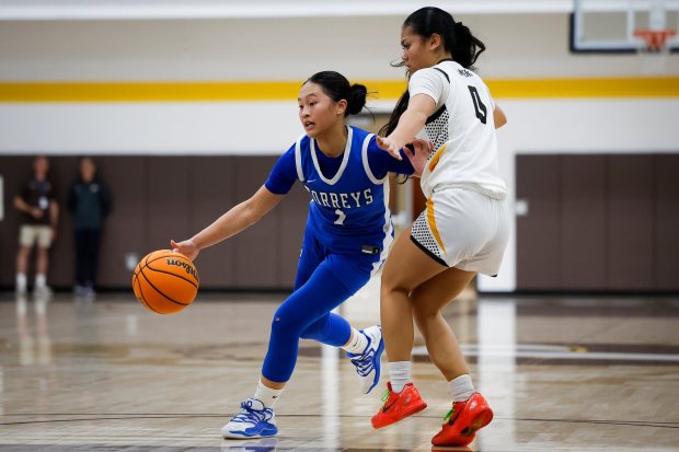 La Jolla Country Day's Safiyah Sugapong dribbles against Francis Parker's Gigi Ong during a game Feb. 6. (Meg McLaughlin / The San Diego Union-Tribune)
