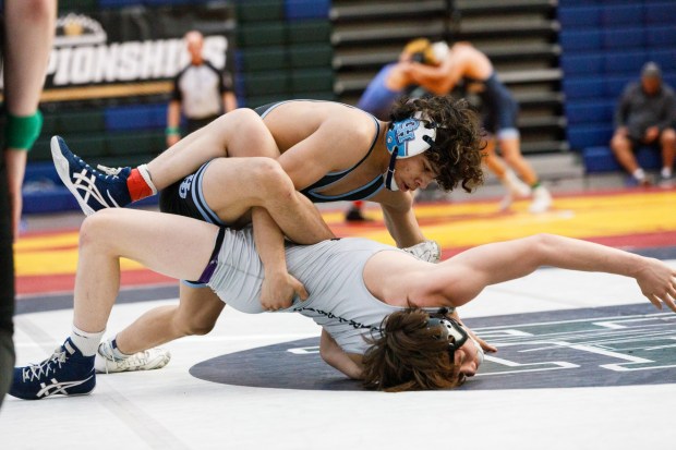 Emilio Escobar in action with Carlsbad's Zephyr Aubuchon during the CIF San Diego Division 1 championship meet at Del Norte High School on Saturday, Feb. 14, 2026. (Kristian Carreon / The San Diego Union-Tribune)