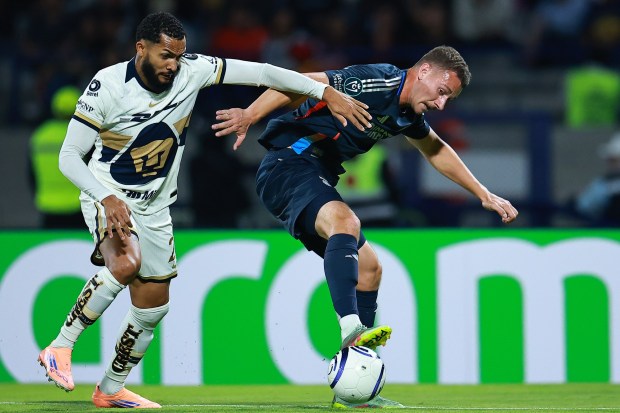Christopher McVey of San Diego FC is put under pressure by Juninho Vieira of Pumas during Tyesday's Concacaf Champions Cup match between Pumas UNAM and San Diego FC at Olimpico Universitario Stadium in Mexico City, Mexico. (Photo by Manuel Velasquez/Getty Images)