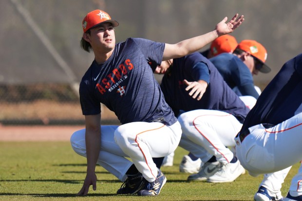 Houston Astros starting pitcher Tatsuya Imai, of Japan, stretches during spring training baseball, Thursday, Feb. 12, 2026, in West Palm Beach, Fla. (AP Photo/Lynne Sladky)
