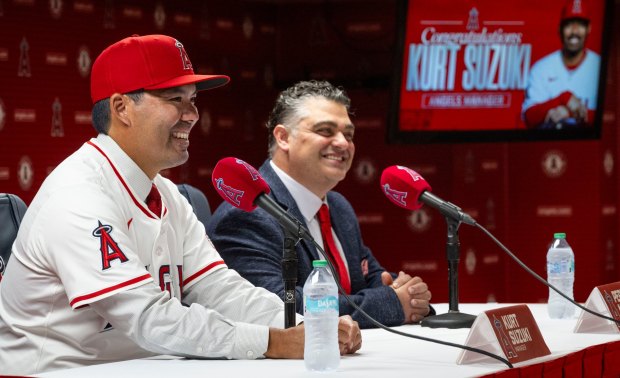 Kurt Suzuki, left, speaks after being announced as the new manager of the Los Angeles Angels by General Manager Perry Minasian during a press conference at the stadium in Anaheim, CA on Wednesday, October 22, 2025. (Photo by Paul Bersebach, Orange County Register/SCNG)