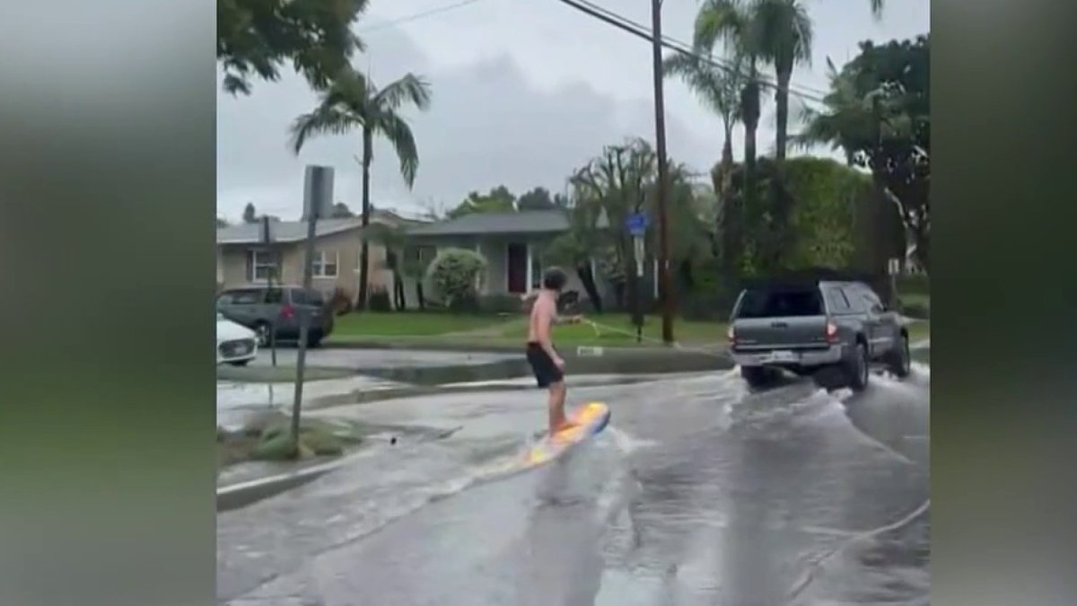 Long Beach man seen surfing on flooded streets – NBC Los Angeles
