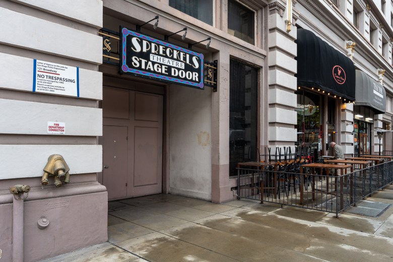 The facade of the Spreckles Theatre. The entrance is labeled as "Stage Door."