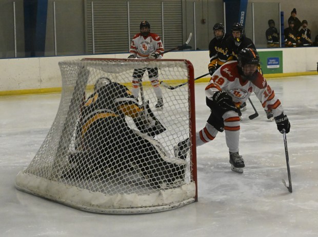Utica-Fraser United's Nate Sheridan (19) gets ready to celebrate after tucking home his shot past North Oakland goaltender Owen Fulscher Tuesday evening. Sheridan finished with two goals and four assists as UFU advanced with an 11-3 victory over the Eagles at the Detroit Skate Club on Feb. 17, 2026. (DAN STICKRADT -- MediaNews Group)