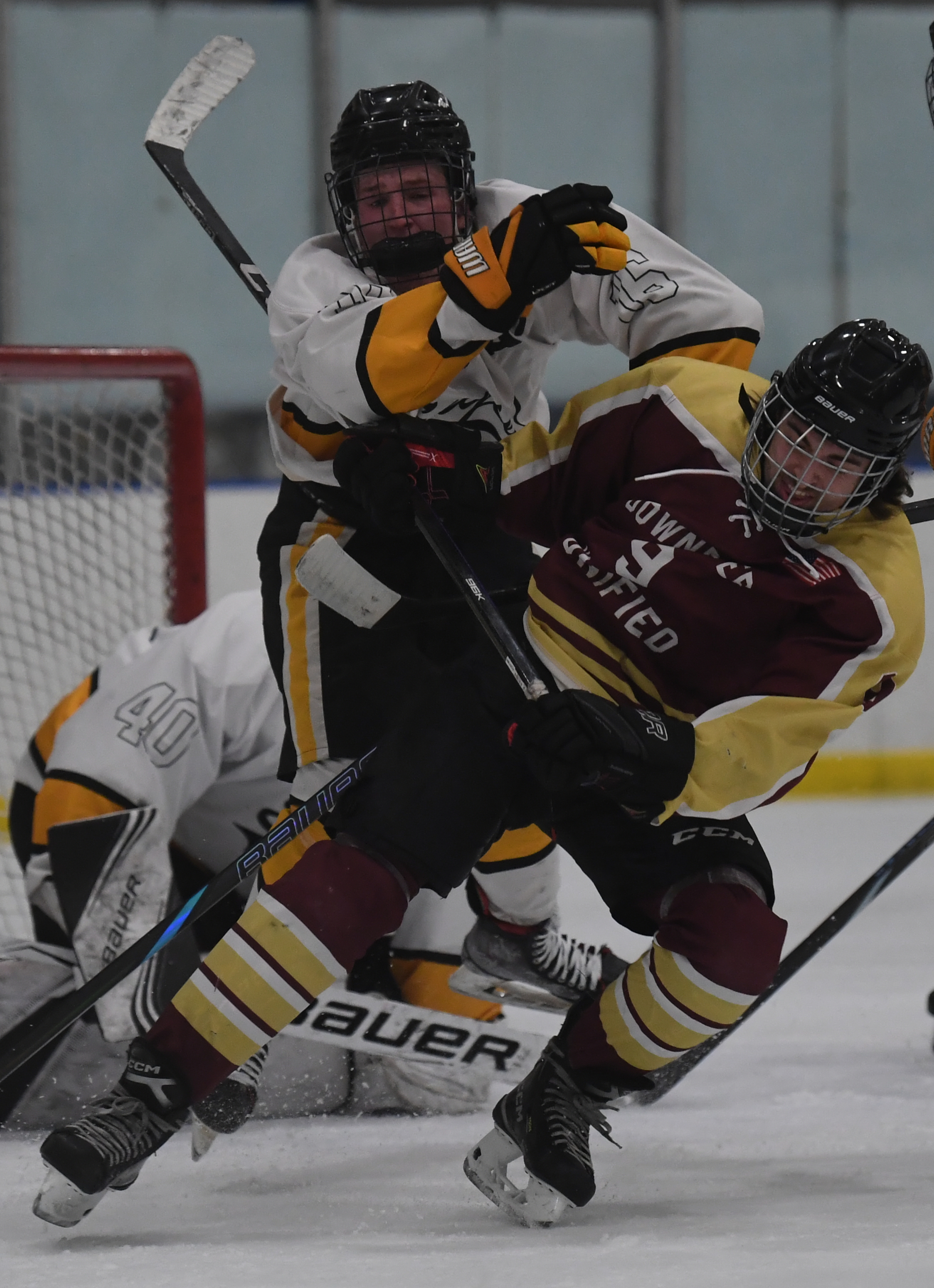 Downriver Unified's Aidan London tries to clear out Downriver Unified's...