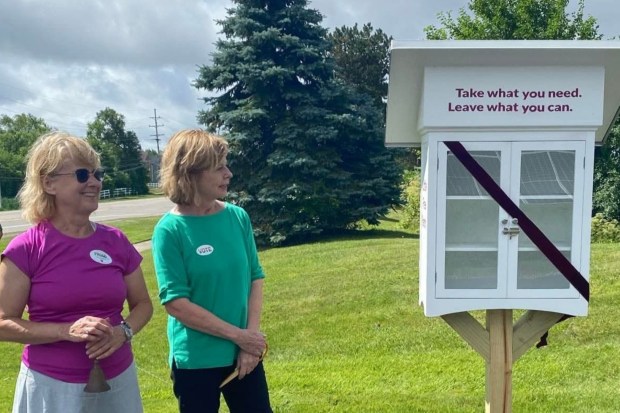 Universalist Unitarian Church of Farmington members Marie Lowry and Joni Tedesco at the June 2024 ribbon cutting for the church's Little Free Pantry in June 2024. (Courtesy, UUC of Farmington)