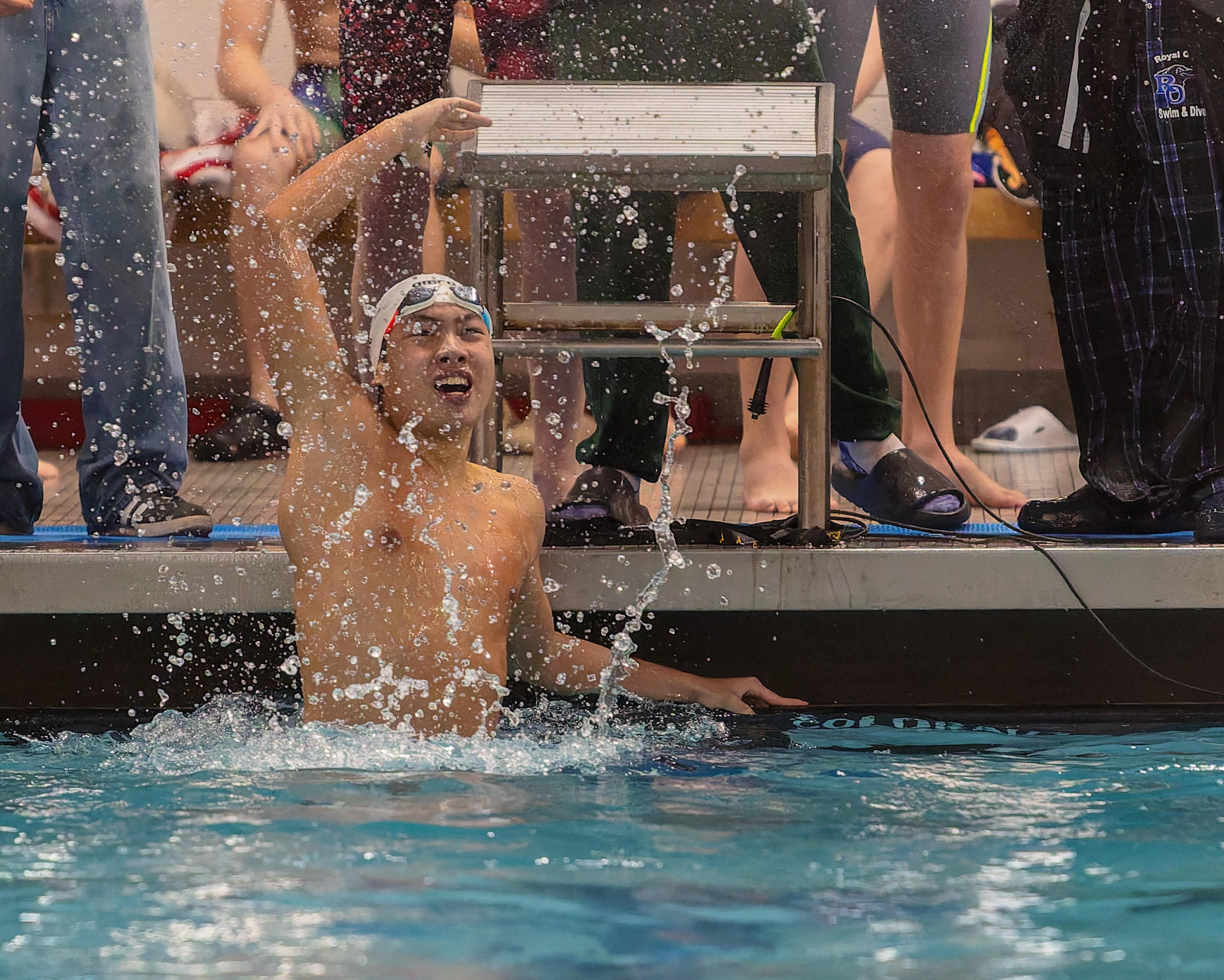 Cranbrook-Kingswood's Ethan Xu celebrates his victory in the 100-yard butterfly...