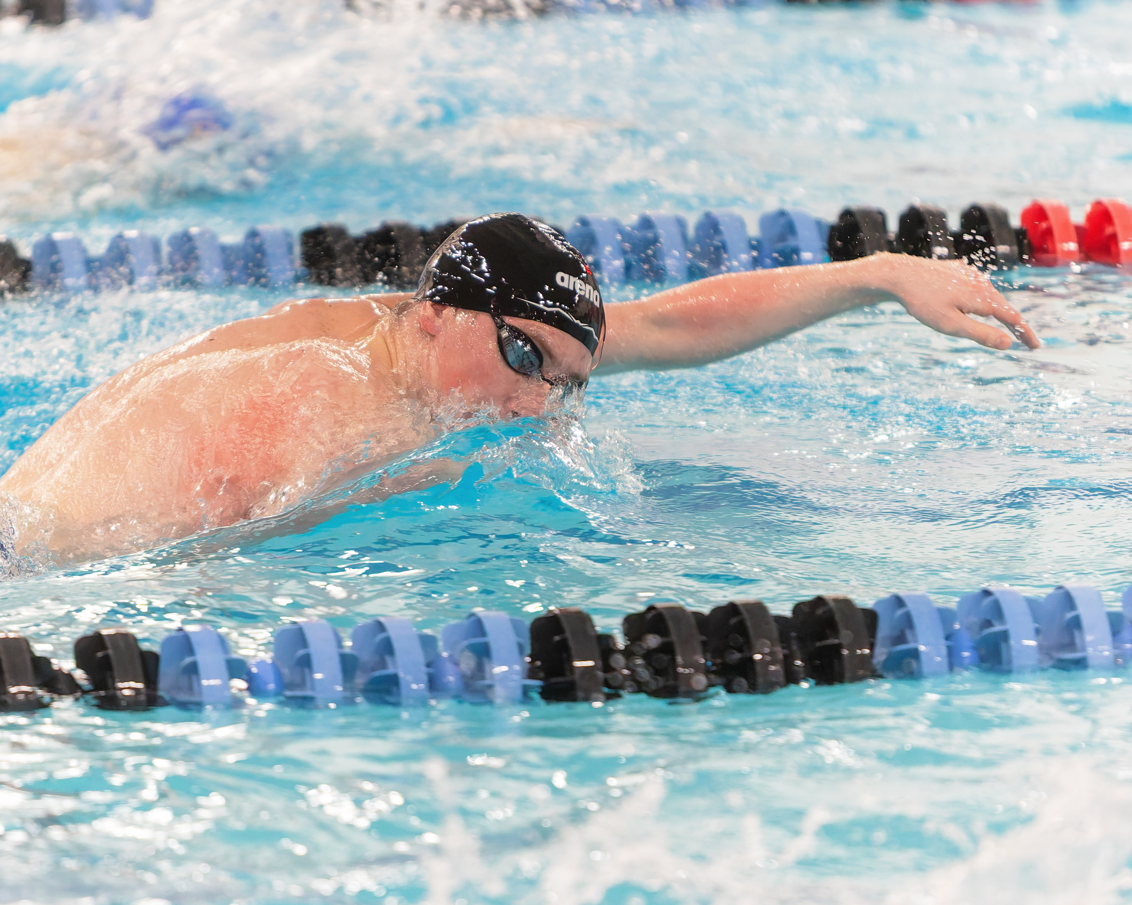 Bloomfield Hills' Victor Malinski swims in the 500-yard freestyle at...