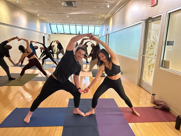 UpDog Yoga Rochester offers partner yoga that focuses on trust, communication and gentle physical connection. You'll support each other through poses, practice breathing together, and enjoy moments of quiet closeness without taking things too seriously. (Photo courtesy of UpDog Yoga Rochester)