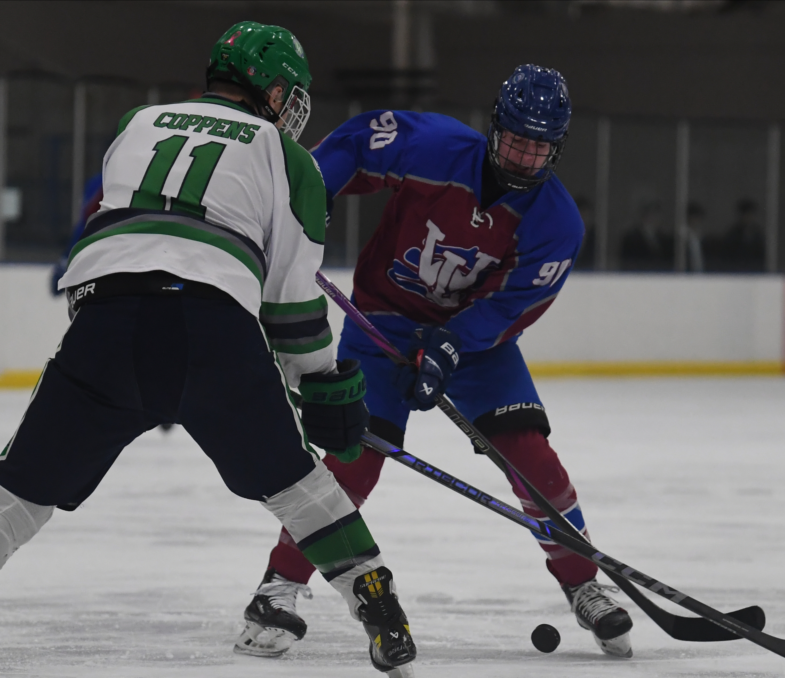 Walled Lake United's Lennard Imhof (90) tries to move around...