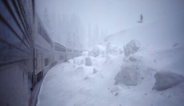 View from onboard passenger train in snow