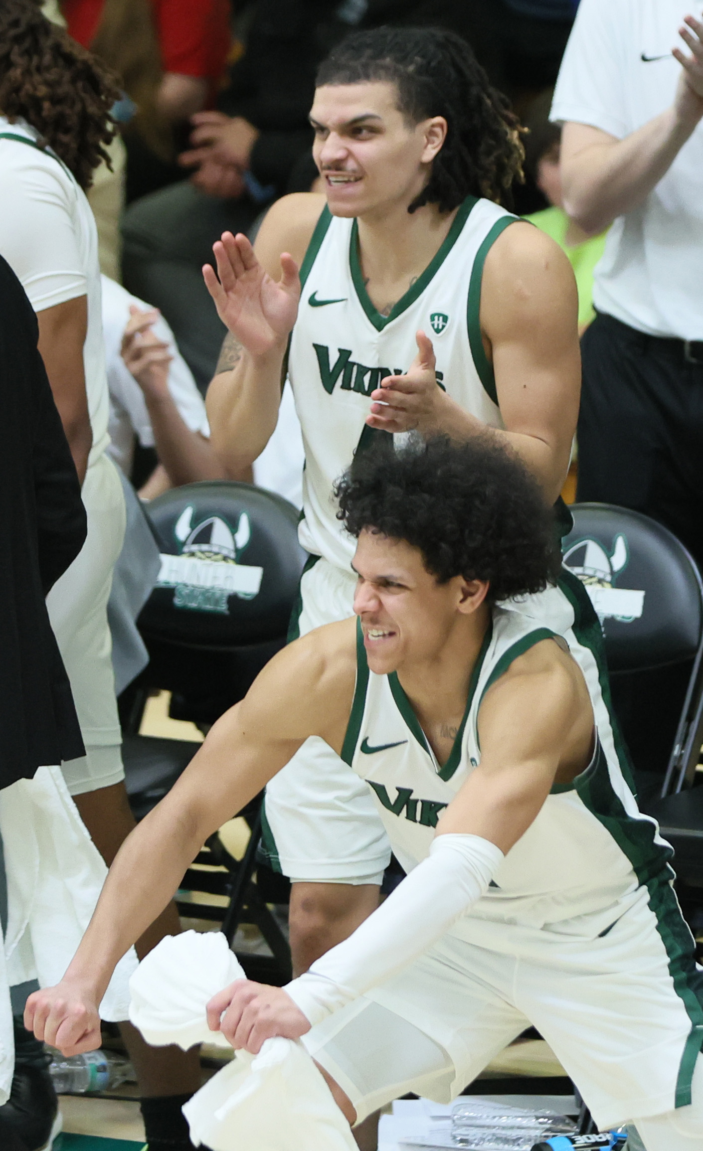 Cleveland State Vikings guard Chevalier Emery (bottom) and Cleveland State Vikings forward Preist Ryan celebrate a come from behind score against the Oakland Golden Grizzlies in the second half.  