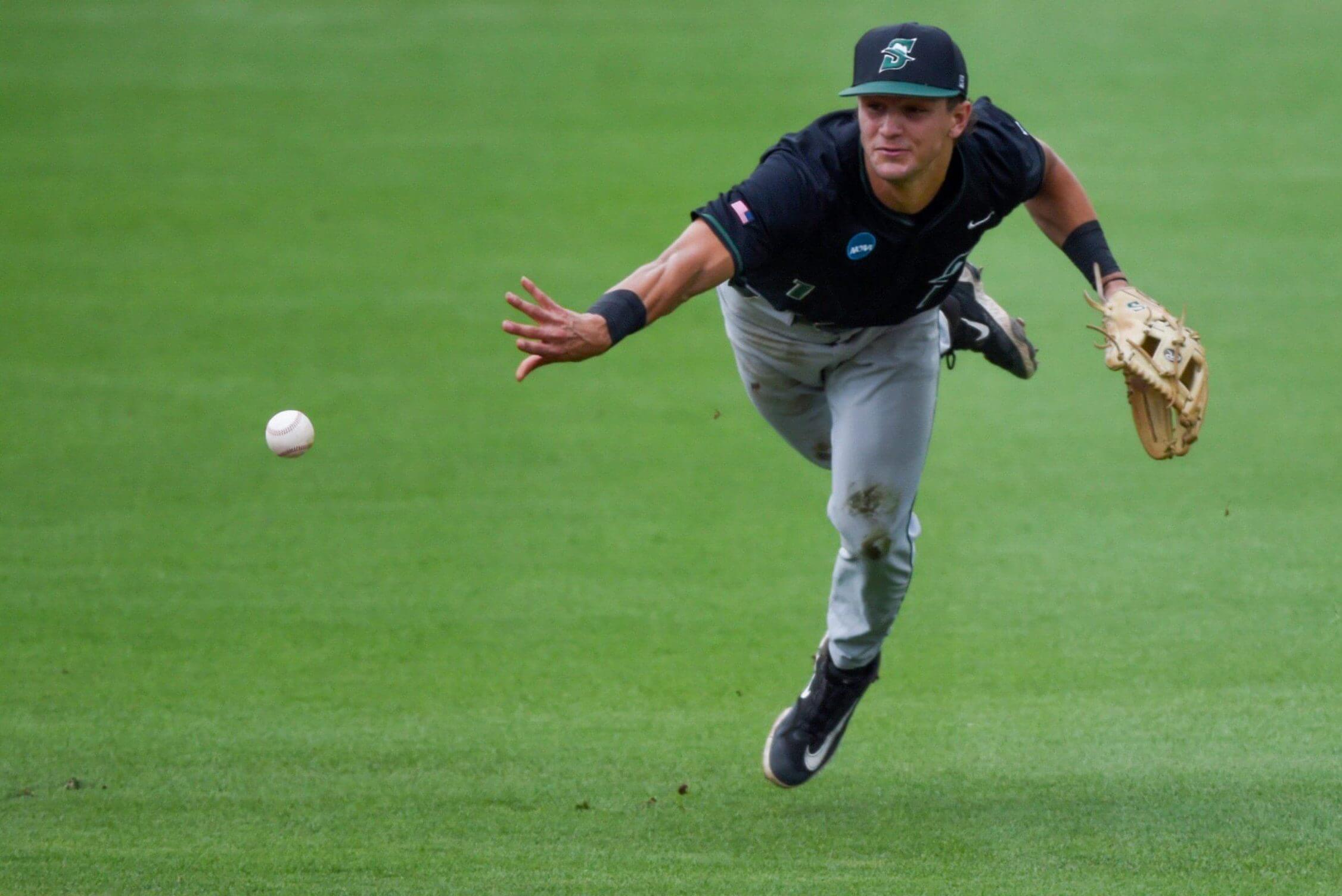 Stetson Hatters' Lorenzo Meola (1) tosses the ball to first against the NC State Wolfpack during the NCAA Baseball Regional Tournament at Plainsman Park.