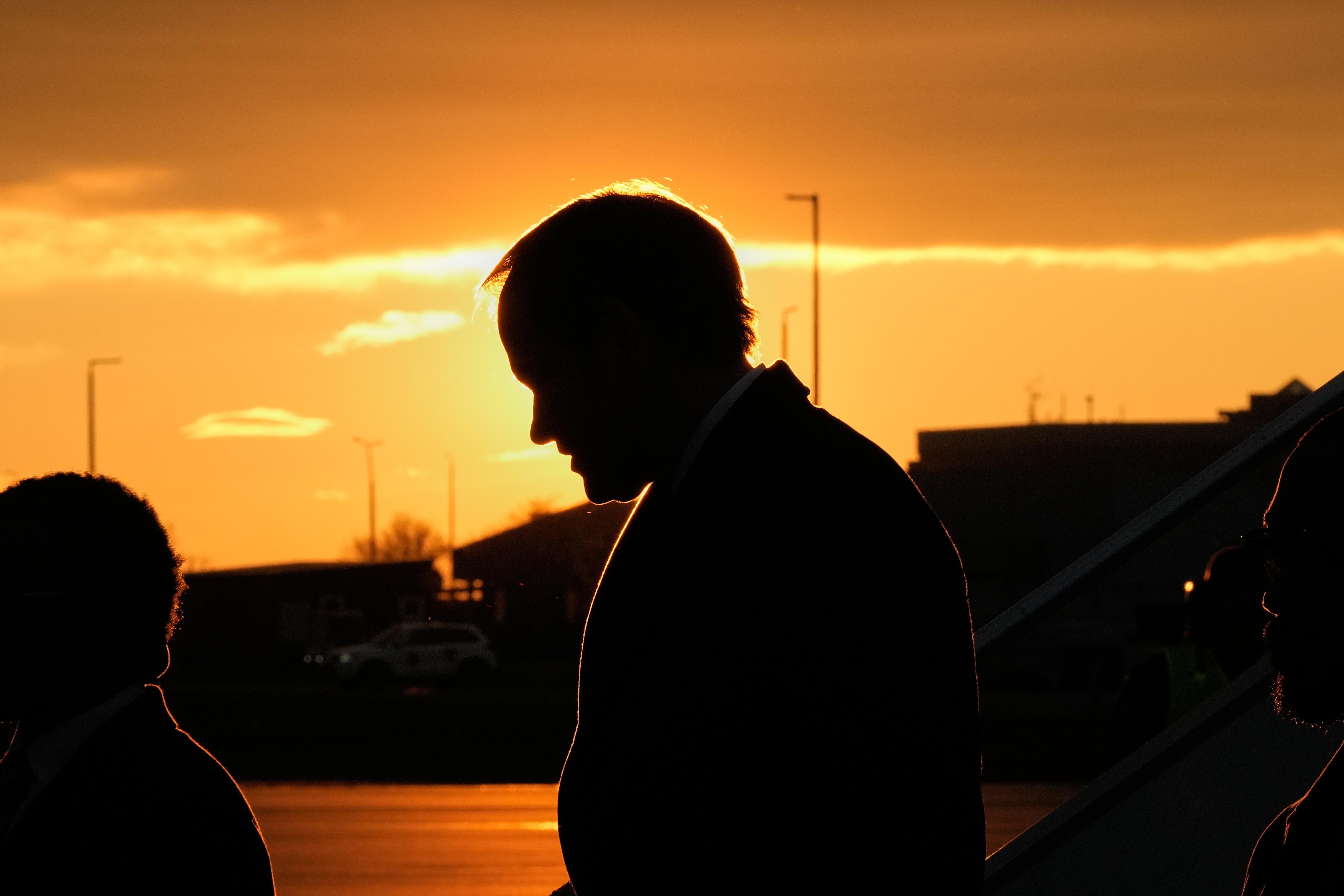 U.S. Secretary of State Marco Rubio, silhouetted against the setting sun.