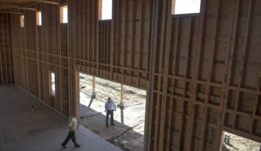 Two men walk through the barn under construction at The Cannery housing project in Davis during construction. The Cannery’s approval in 2013 was controversial, but today Davis faces renewed pressure to approve housing like Village Farms as shrinking school enrollment reflects the city’s declining population of young families.