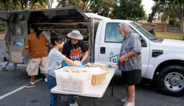 Folks set up the food truck operation.