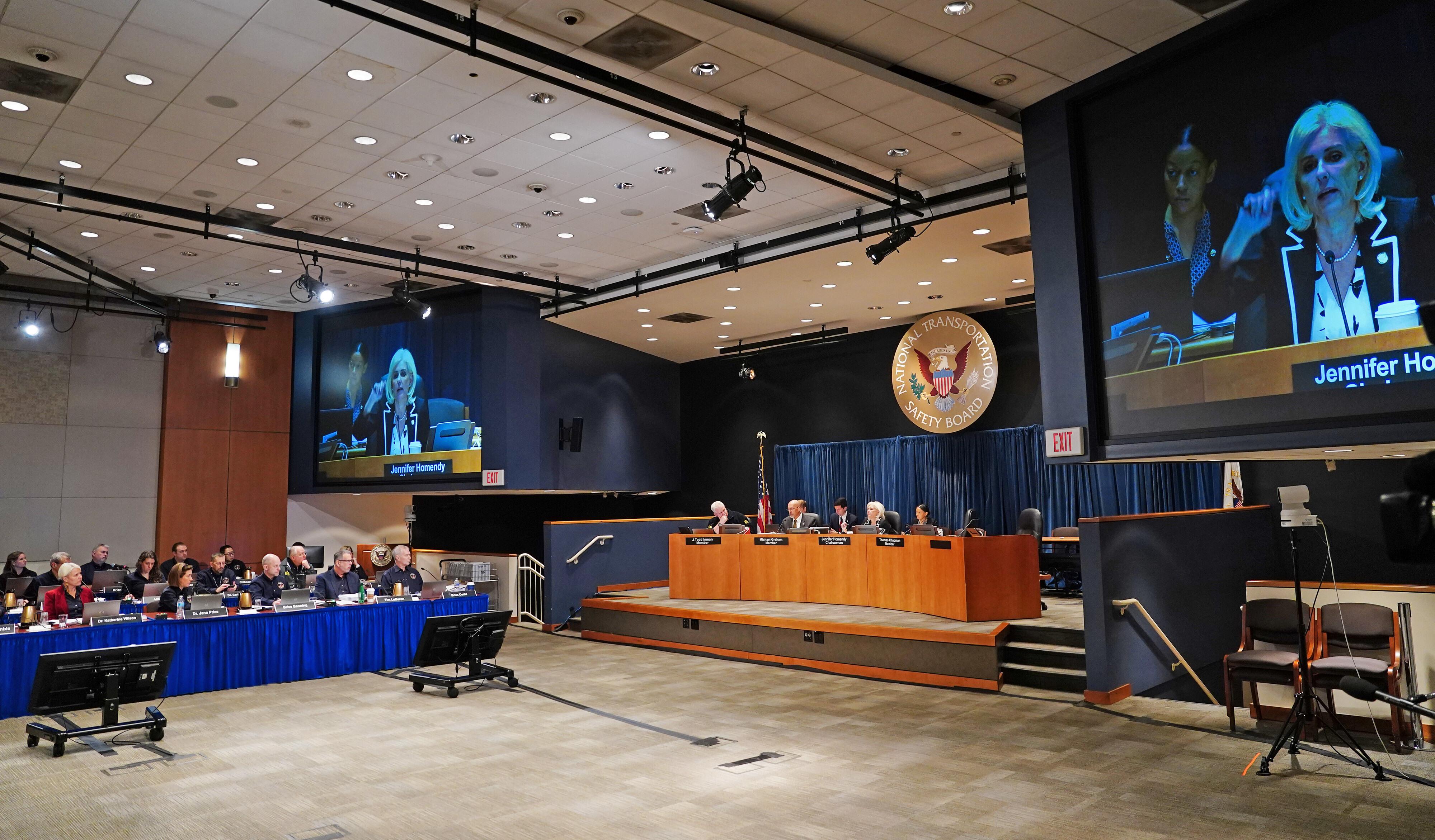 Jana Price, second from left, testifies during a National Transportation...