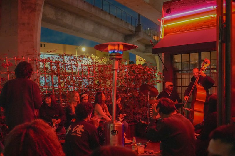 DESCRIBE THE IMAGE FOR ACCESSIBILITY, EXAMPLE: Photo of a chef putting red sauce onto an omelette.