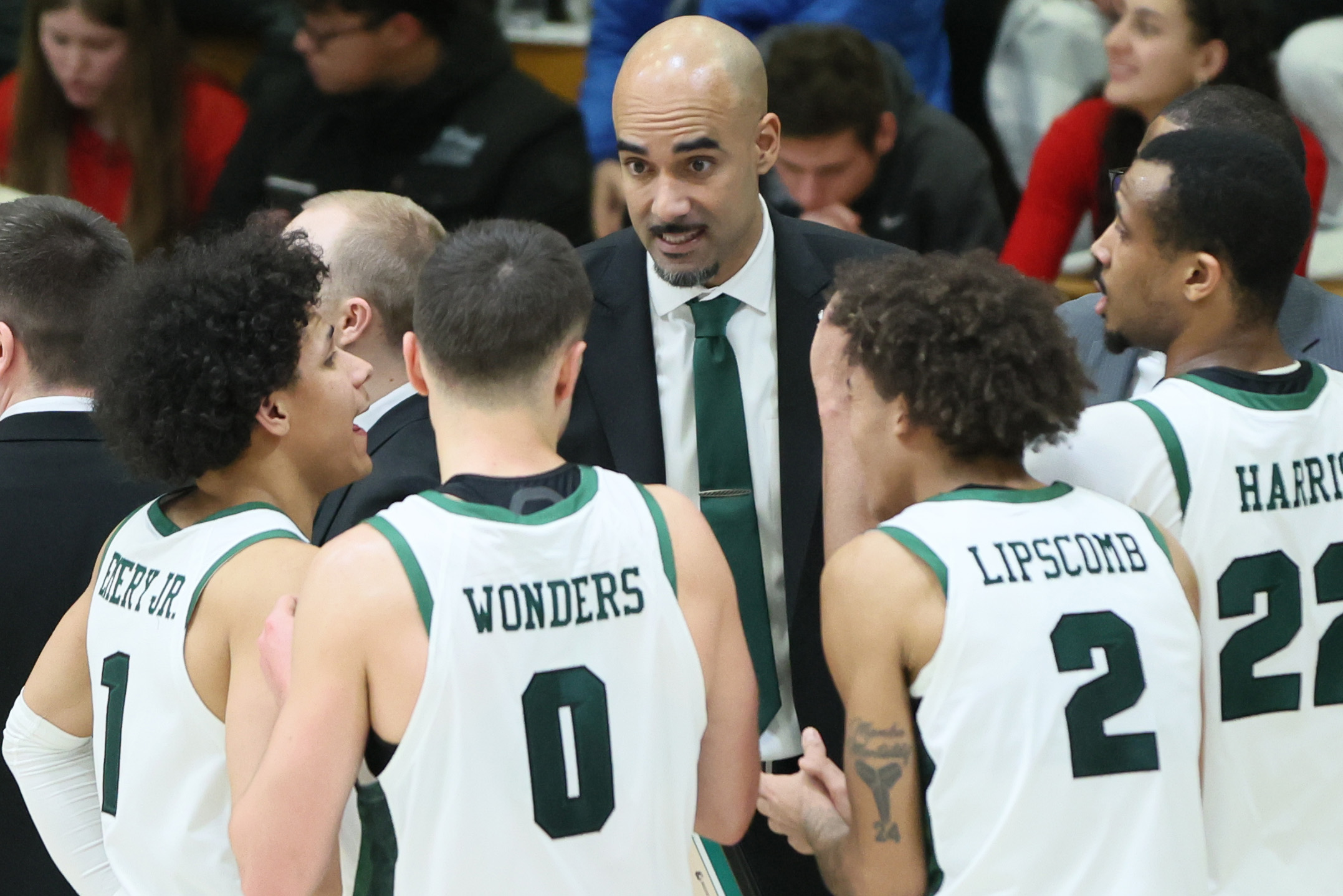 Cleveland State Vikings head coach Rob Summers talks with his team during a time out in the second half.  
