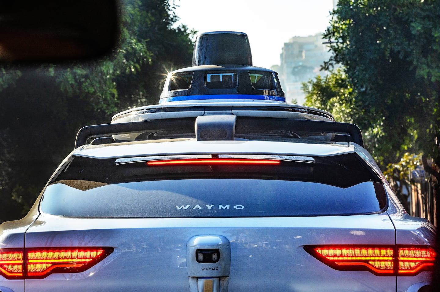 A Waymo equipped with 360 degree technology including 29 cameras, five lidars (which are used for mapping and sensing) and six radar trackers climbs a hill in San Francisco.