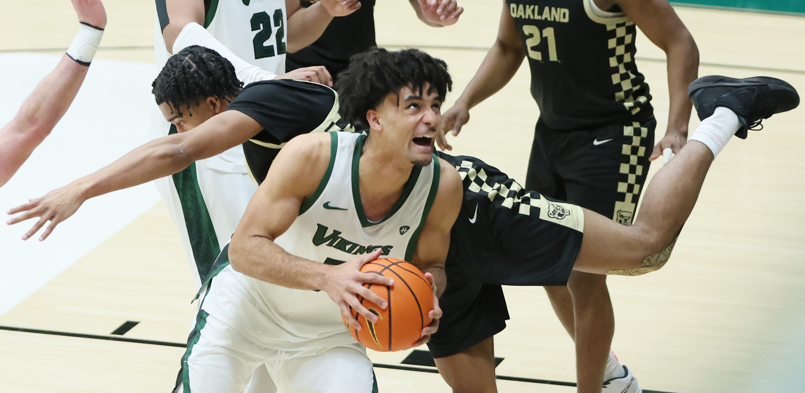 Cleveland State Vikings forward Dayan Nessah is fouled by Oakland Golden Grizzlies guard Warren Marshall IV on his drive to the basket in the second half.  