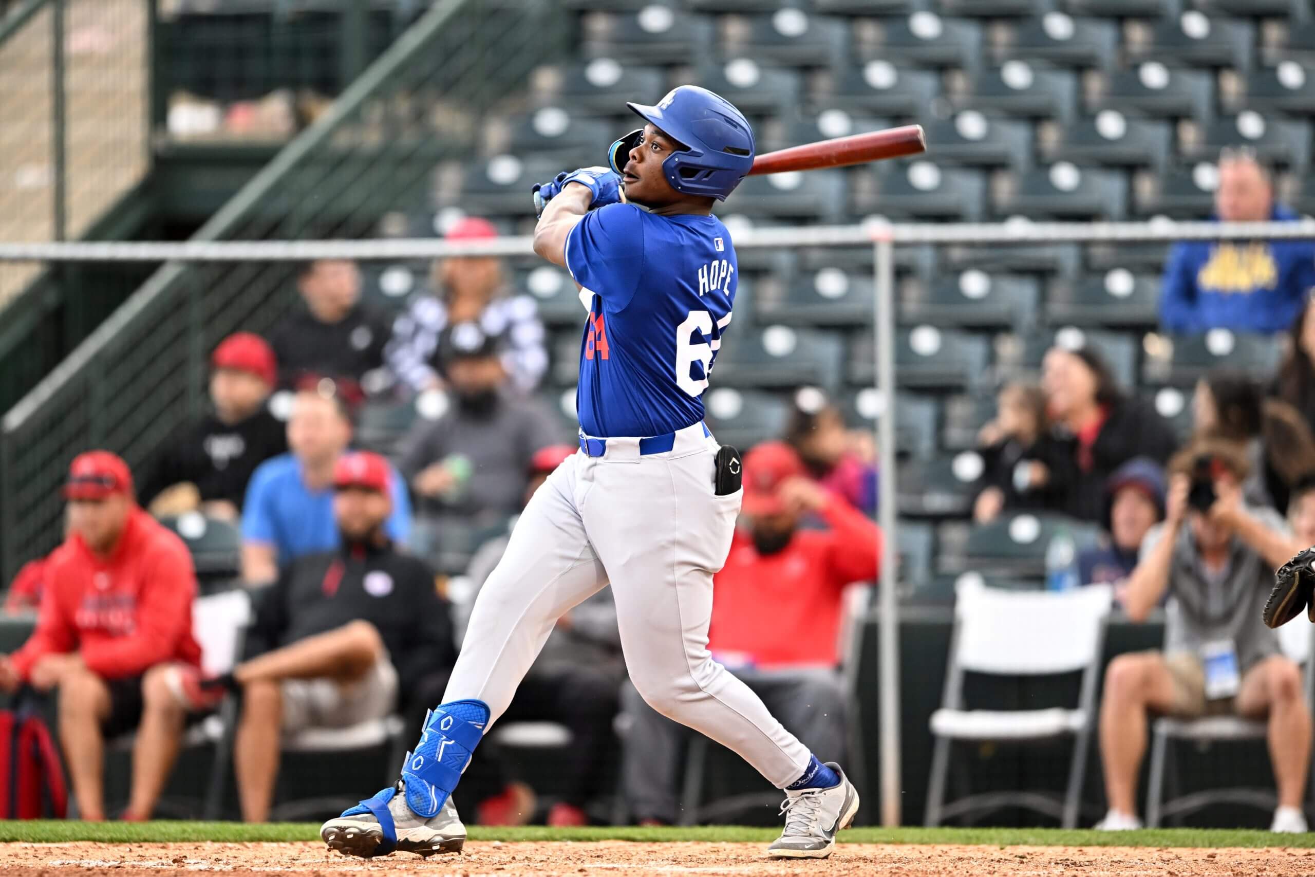 Zyhir Hope #64 of the Los Angeles Dodgers bats during the sixth inning of a spring training Spring Breakout game against the Los Angeles Angels at Tempe Diablo Stadium. 