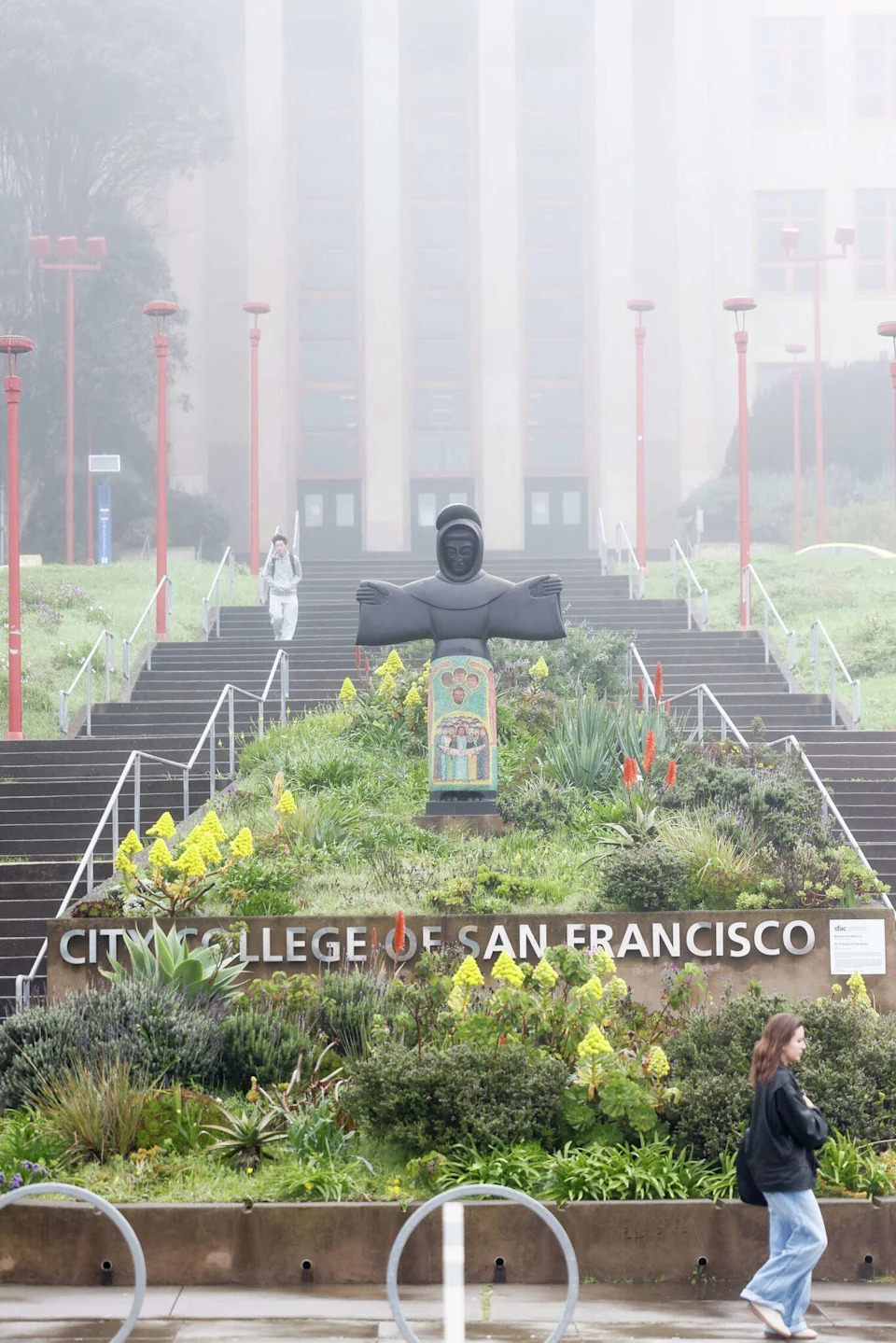 "St. Francis of the Guns" by Benny Bufano is seen in front of the Science Building at City College of San Francisco. (Lea Suzuki/S.F. Chronicle)