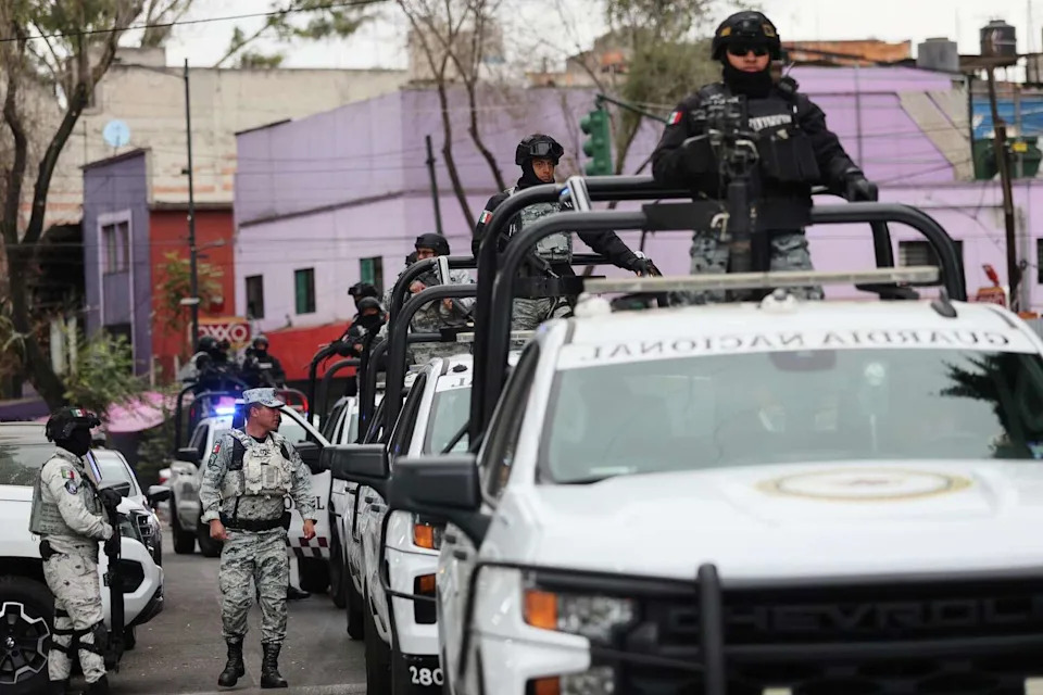 National Guards patrol the area outside of the General Prosecutor's headquarters in Mexico City on Feb. 22, 2026, after authorities reported that the Mexican Army killed Jalisco New Generation Cartel leader Nemesio Oseguera Cervantes. (Ginette Riquelme/Associated Press)