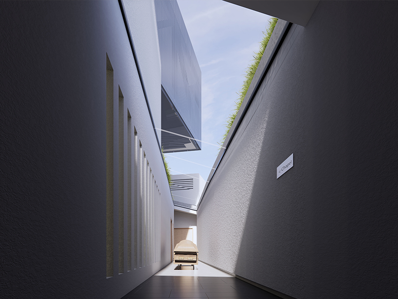 reflective metal facade wraps another side funeral home’s elevated volume in san francisco