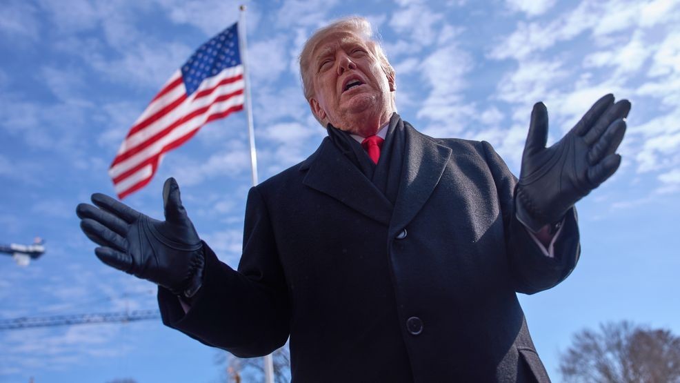 President Donald Trump speaks with reporters before boarding Marine One on South Lawn of the White House, Tuesday, Jan. 27, 2026, in Washington. (AP Photo/Evan Vucci)