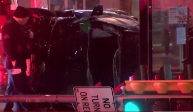 Car slams into pole, flips on its side in Milwaukee