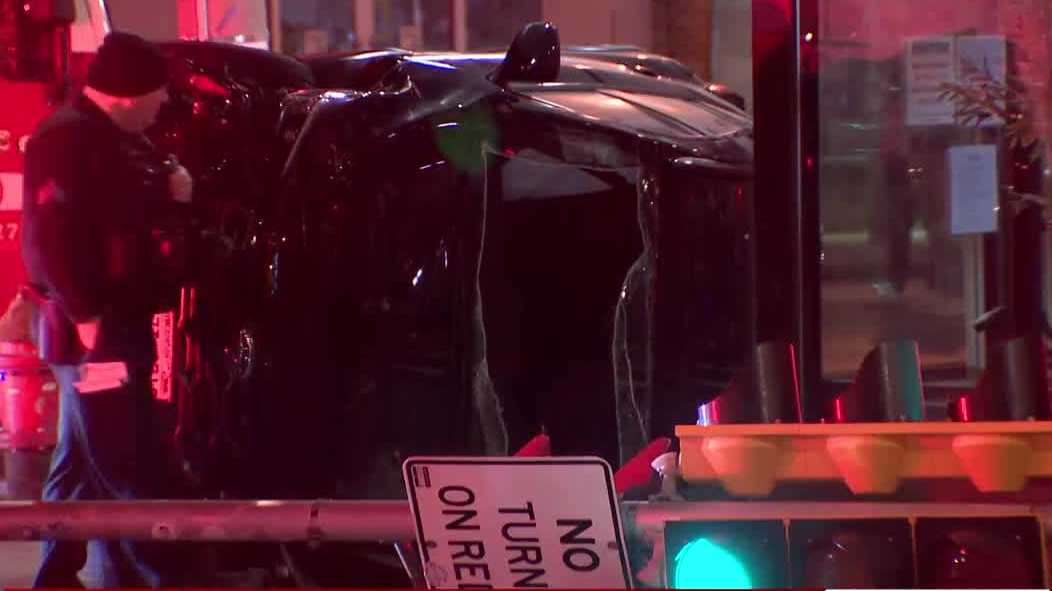 Car slams into pole, flips on its side in Milwaukee