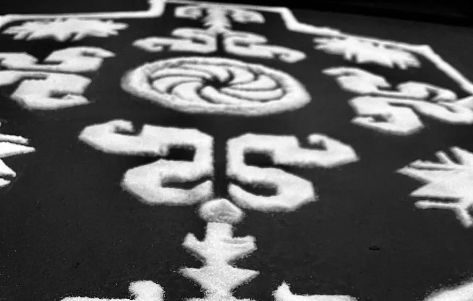 intricate white symmetrical patterns shaped on a black background