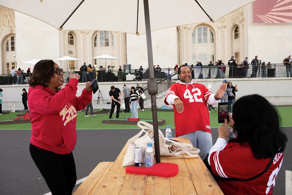 Melissa Halmon, left, and Joseph Wright dance during the Super Bowl fan zone and watch party at the Henry J. Kaiser Center for the Arts in Oakland on Sunday. (Laure Andrillon/For the S.F. Chronicle)