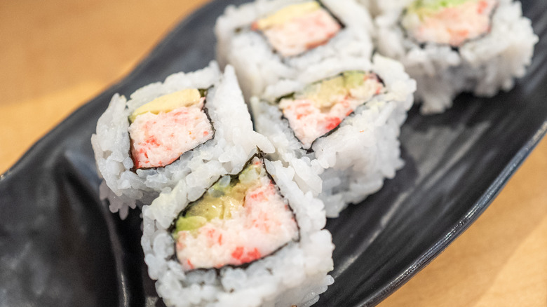 California roll with real crab on black plate