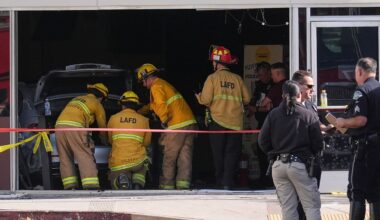 First responders gather around a car seen inside of a 99 Ranch Market at the scene of a fatal crash Thursday, Feb. 5, 2026, in the Westwood neighborhood of Los Angeles.(AP Photo/Damian Dovarganes)