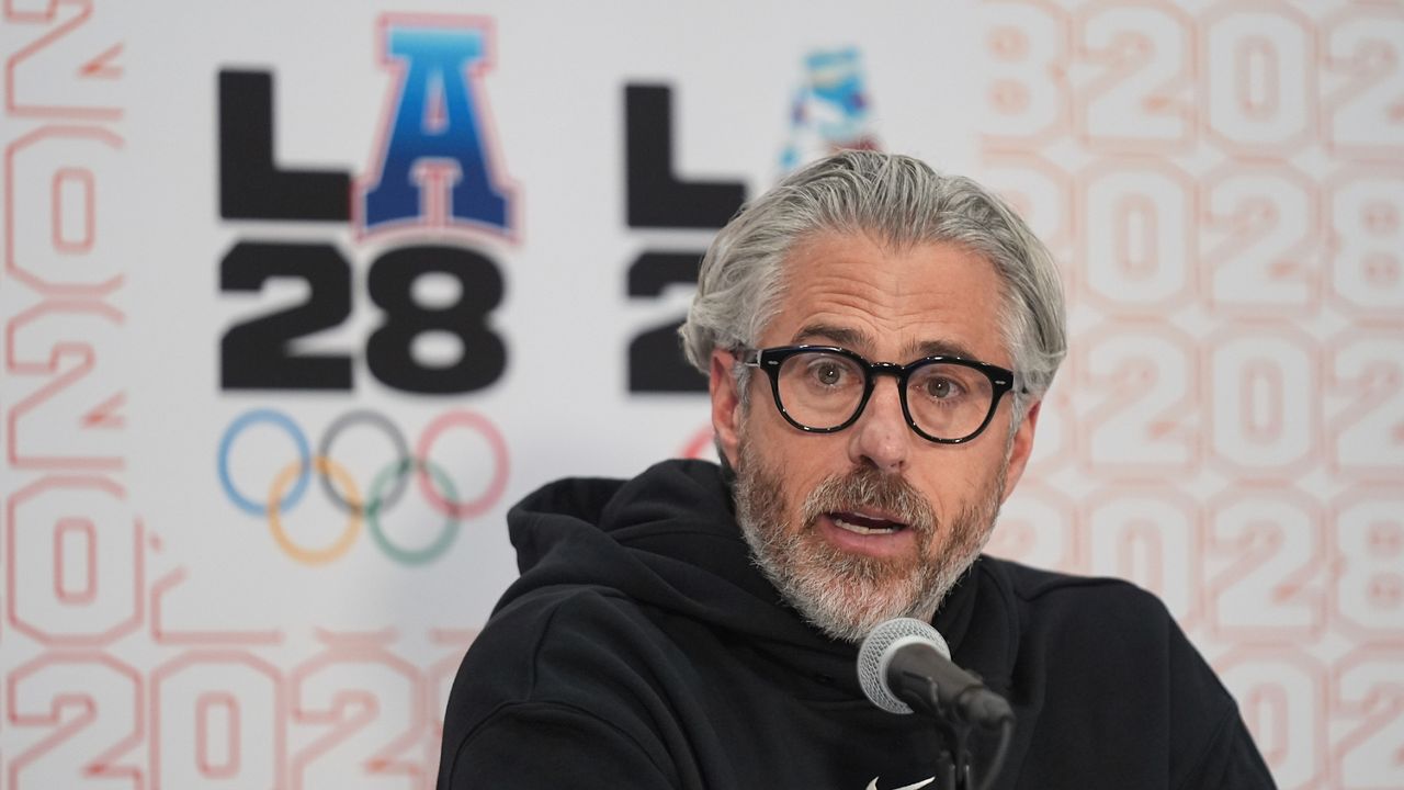 Casey Wasserman, LA28 chairperson and president, takes questions from the media during a news conference in Los Angeles on June 5, 2025. (AP Photo/Damian Dovarganes)