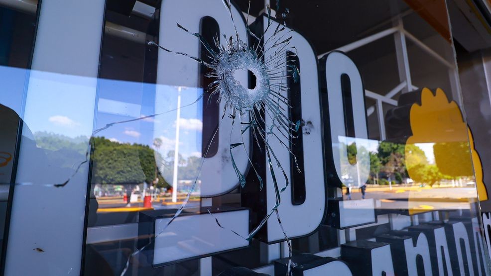 GUADALAJARA, MEXICO - FEBRUARY 22: A view of a window with a hole at a shopping center on February 22, 2026 in Guadalajara, Mexico. Road blockades and burnt vehicles have been reported in several parts of Mexico since early morning. The Secretariat of National Defense of Mexico has confirmed that during a security operation in Tapalpa, Jalisco,  Nemesio Oseguera Cervantes, known as 'El Mencho' leader of the Jalisco New Generation Cartel was killed, along with four other members. Three Mexican soldiers were wounded during the operation. (Photo by Carlos Zepeda/Getty Images)