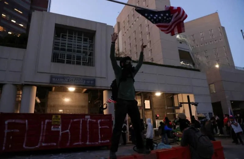 SENSITIVE MATERIAL. THIS IMAGE MAY OFFEND OR DISTURB People protest against U.S. Immigration and Customs Enforcement (ICE) and U.S. President Donald Trump's immigration policies outside the Metropolitan Detention Center (MDC) in Los Angeles, California, U.S., January 30, 2026. (credit: REUTERS/JILL CONNELLY)