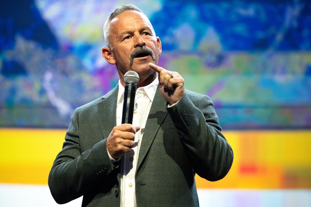 Chad Bianco speaking at a panel discussion.