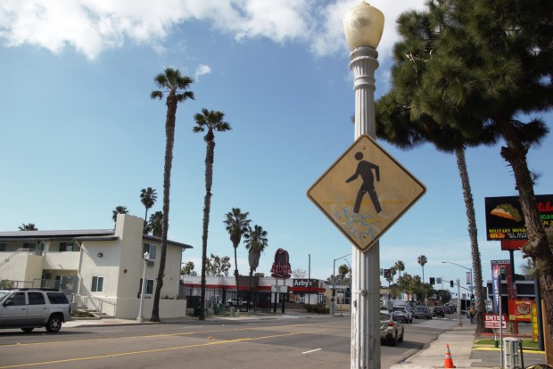 A pedestrian crossing sign is seen on Midway Drive just before Duke Street. (Tyler Faurot)