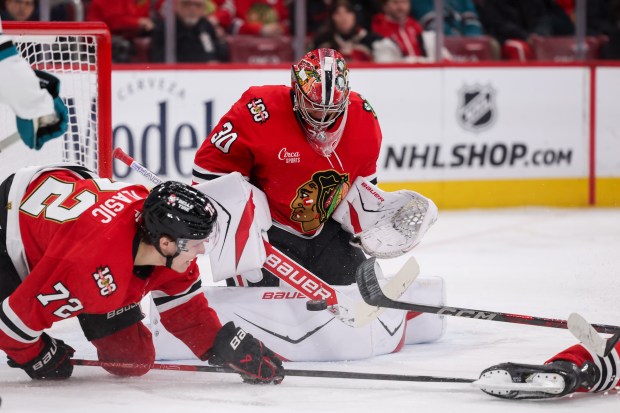 Chicago Blackhawks goaltender Spencer Knight (30) blocks a shot from San Jose Sharks center Macklin Celebrini (71) during the second period at the United Center Monday Feb. 2, 2026 in Chicago. (Armando L. Sanchez/Chicago Tribune)