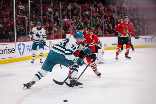 Chicago Blackhawks defenseman Connor Murphy (5) and San Jose Sharks center Tyler Toffoli (73) chase after the puck during the second period at the United Center Monday Feb. 2, 2026 in Chicago. (Armando L. Sanchez/Chicago Tribune)