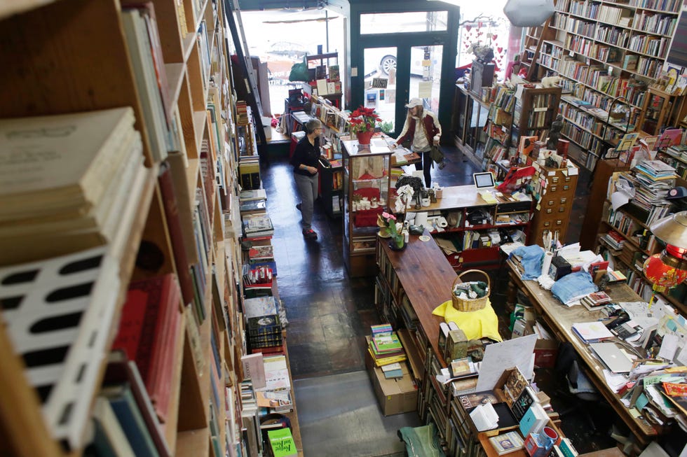 Tèrna Rosendahl (left), bookseller, helps a customer as she works at Bell's Books  on Tuesday, January 31, 2017 in Palo Alto, Calif.